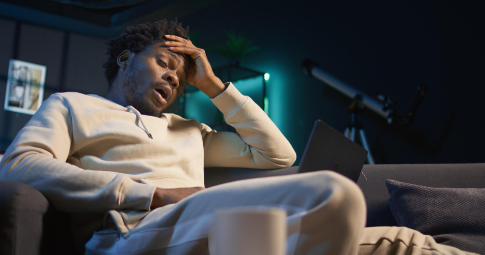 Person experiencing heightened anxiety and sleep disruption at night
